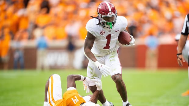 Alabama running back Jahmyr Gibbs (1) runs past Tennessee defensive back Christian Charles (14) during Tennessee's game against Alabama in Neyland Stadium in Knoxville, Tenn., on Saturday, Oct. 15, 2022.