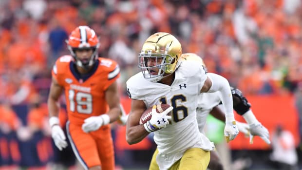 Oct 29, 2022; Syracuse, New York, USA; Notre Dame Fighting Irish safety Brandon Joseph (16) returns an interception for a touchdown against the Syracuse Orange in the first quarter at JMA Wireless Dome.