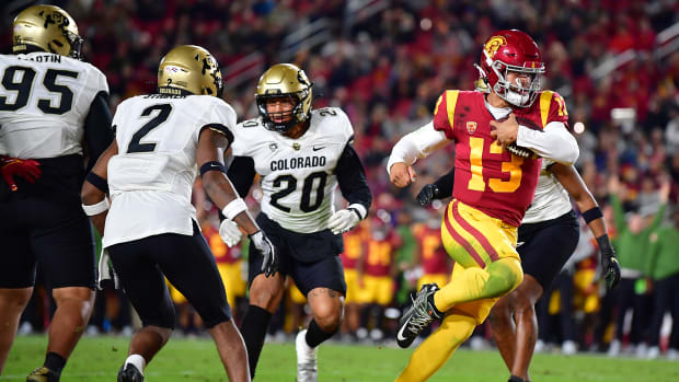 Nov 11, 2022; Los Angeles, California, USA; Southern California Trojans quarterback Caleb Williams (13) runs the ball in for a touchdown against the Colorado Buffaloes during the first half at the Los Angeles Memorial Coliseum.