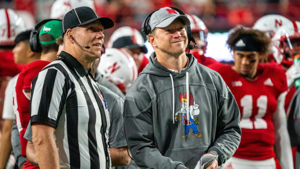 Sep 10, 2022; Lincoln, Nebraska, USA; Nebraska Cornhuskers head coach Scott Frost (right) smiles while watching a review of a touchdown against the Georgia Southern Eagles during the fourth quarter at Memorial Stadium.