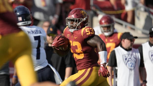Sep 3, 2022; Los Angeles, California, USA; Southern California Trojans linebacker Shane Lee (53) scores a touchdown on an interception return against the Rice Owls in the second half at United Airlines Field at Los Angeles Memorial Coliseum.