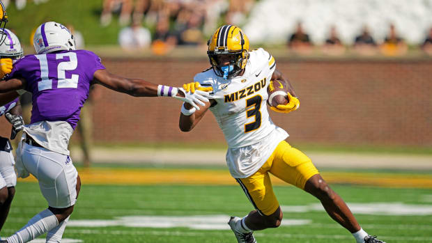 Sep 17, 2022; Columbia, Missouri, USA; Missouri Tigers wide receiver Luther Burden III (3) runs the ball against Abilene Christian Wildcats defensive back Triston Anderson (12) during the first half at Faurot Field at Memorial Stadium.