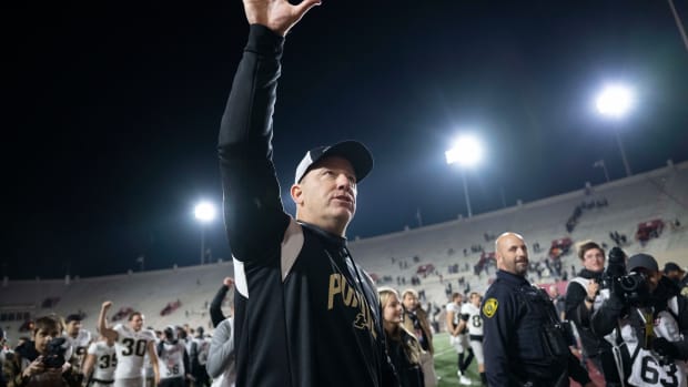 Nov 26, 2022; Bloomington, Indiana, USA; Purdue Boilermakers head coach Jeff Brohm waves toward the fan section after winning the game against the Indiana Hoosiers at Memorial Stadium.
