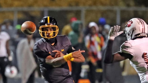 Detroit King quarterback Dante Moore (5) passes against River Rouge during first-half action on Friday, Oct. 28, 2022.