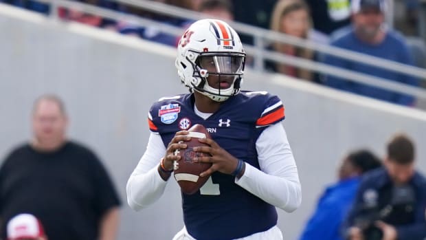 Dec 28, 2021; Birmingham, Alabama, USA; Auburn Tigers quarterback TJ Finley (1) looks to pass against the Houston Cougars during the first half of the 2021 Birmingham Bowl at Protective Stadium.