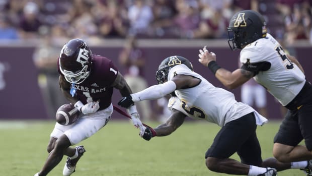Sep 10, 2022; College Station, Texas, USA; Texas A&M Aggies wide receiver Evan Stewart (1) fumbles the ball against Appalachian State Mountaineers defensive back Dexter Lawson Jr. (5) in the third quarter at Kyle Field. Appalachian State Mountaineers won 17 to 14.