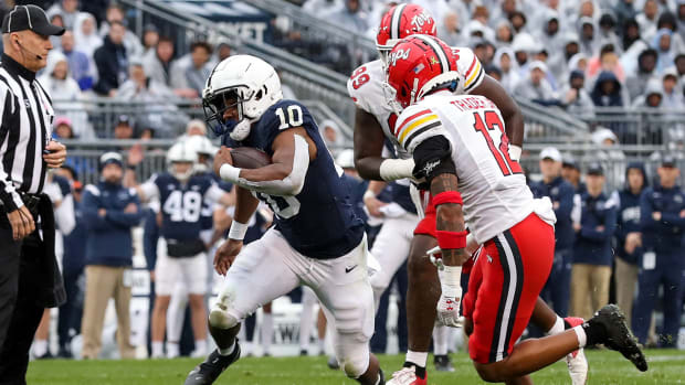 Nov 12, 2022; University Park, Pennsylvania, USA; Penn State Nittany Lions running back Nicholas Singleton (10) runs with the ball during the first quarter against the Maryland Terrapins at Beaver Stadium.