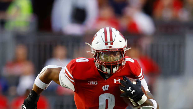 Sep 3, 2022; Madison, Wisconsin, USA; Wisconsin Badgers running back Braelon Allen (0) rushes with the football during the second quarter against the Illinois State Redbirds at Camp Randall Stadium. Mandatory Credit: Jeff Hanisch-USA TODAY Sports