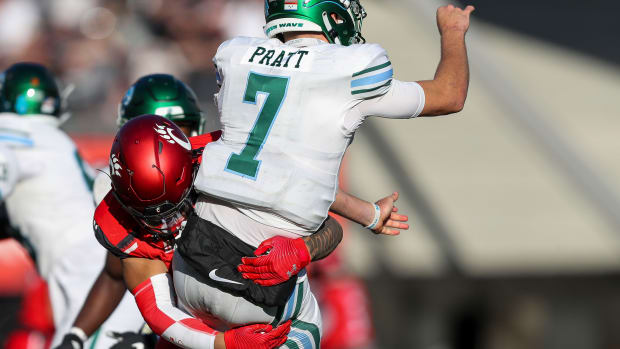 Nov 25, 2022; Cincinnati, Ohio, USA; Cincinnati Bearcats linebacker Ivan Pace Jr. (0) hits with Tulane Green Wave quarterback Michael Pratt (7) in the second half at Nippert Stadium.