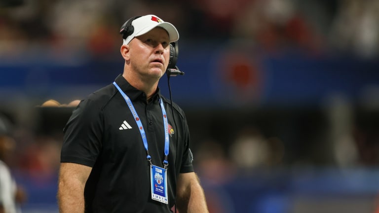 Louisville's Brohm aims to deliver spark to alma mater