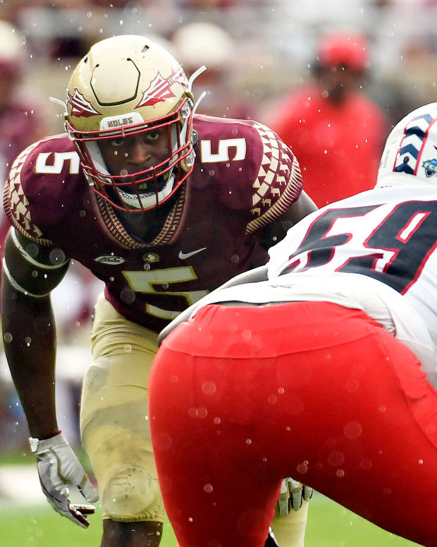 Aug 27, 2022; Tallahassee, Florida, USA; Florida State Seminoles defensive end Jared Verse (5) lines up against Duquesne Dukes offensive lineman Chris Oliver (59) during the first half at Doak S. Campbell Stadium. Mandatory Credit: Melina Myers-USA TODAY Sports