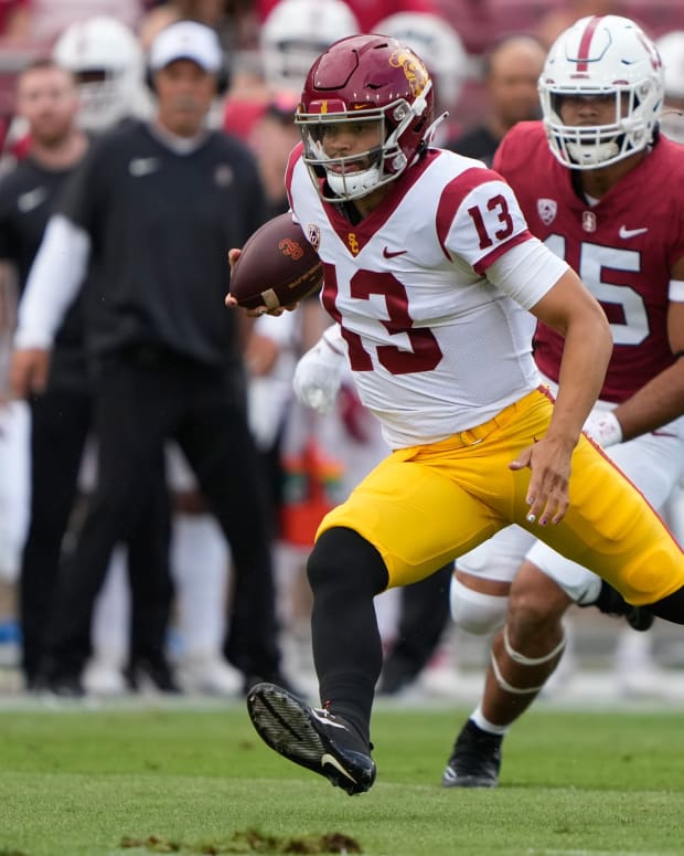 Sep 10, 2022; Stanford, California, USA; USC Trojans quarterback Caleb Williams (13) runs with the football against the Stanford Cardinal during the first quarter at Stanford Stadium.