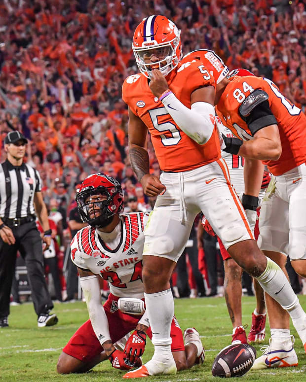 Clemson quarterback D.J. Uiagalelei (5) scores by NC State defensive back Derrek Pitts (24) on a one-yard touchdown run during the second quarter at Memorial Stadium in Clemson, South Carolina Saturday, October 1, 2022.