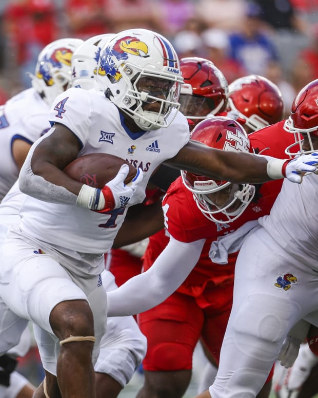 Sep 17, 2022; Houston, Texas, USA; Kansas Jayhawks running back Devin Neal (4) runs with the ball during the first quarter against the Houston Cougars at TDECU Stadium.