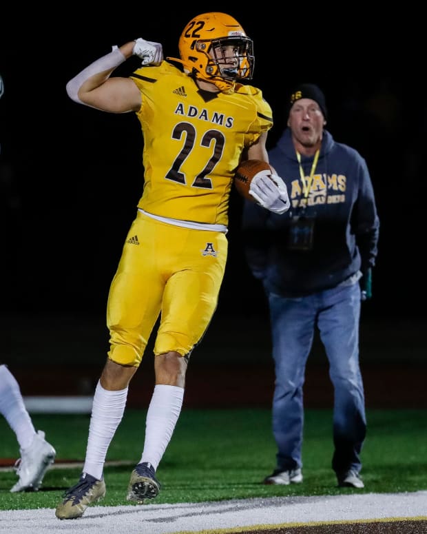 Rochester Adams wide receiver Brady Prieskorn (22) scores a touchdown against West Bloomfield during the first half at Rochester Adams High School in Rochester Hills on Friday, Sept. 23, 2022