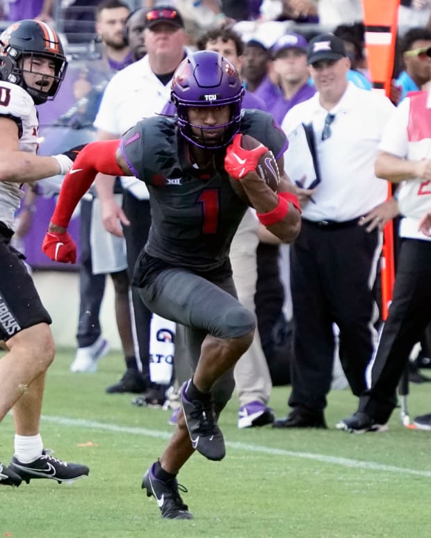 Oct 15, 2022; Fort Worth, Texas, USA; TCU Horned Frogs wide receiver Quentin Johnston (1) runs after the catch against the Oklahoma State Cowboys during the second half at Amon G. Carter Stadium.