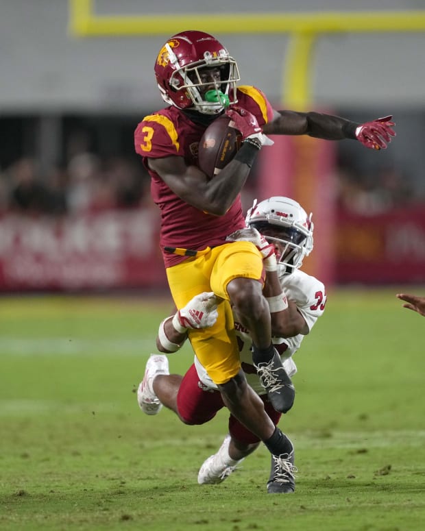 Sep 17, 2022; Los Angeles, California, USA; Southern California Trojans wide receiver Jordan Addison (3) carries the ball against the Fresno State Bulldogs in the second half at United Airlines Field at Los Angeles Memorial Coliseum.