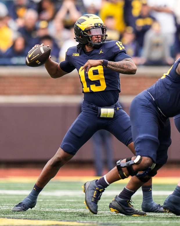 Team Blue quarterback Bryce Underwood (19) makes a pass against Team Maize during the first half of the spring game at Michigan Stadium in Ann Arbor on Saturday, April 19, 2025.