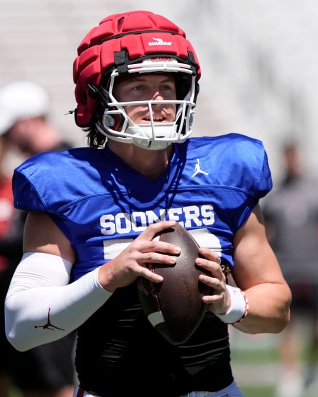 Oklahoma's John Mateer looks to throw a pass during the University of Oklahoma Sooners Crimson Combine at Gaylord Family - Oklahoma Memorial Stadium in Norman, Okla., Saturday, April, 12, 2025.