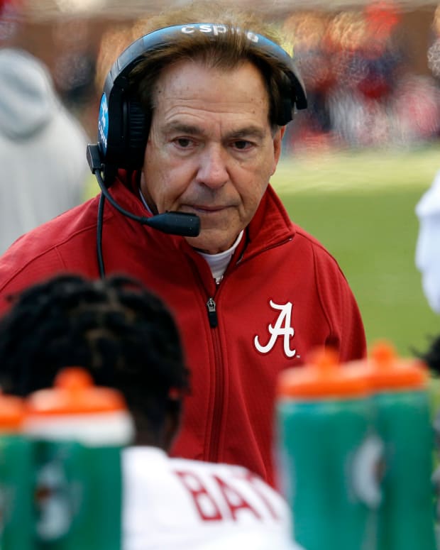 Nov 12, 2022; Oxford, Mississippi, USA; Alabama Crimson Tide head coach Nick Saban talks with players on the sideline during a timeout during the first half at Vaught-Hemingway Stadium.