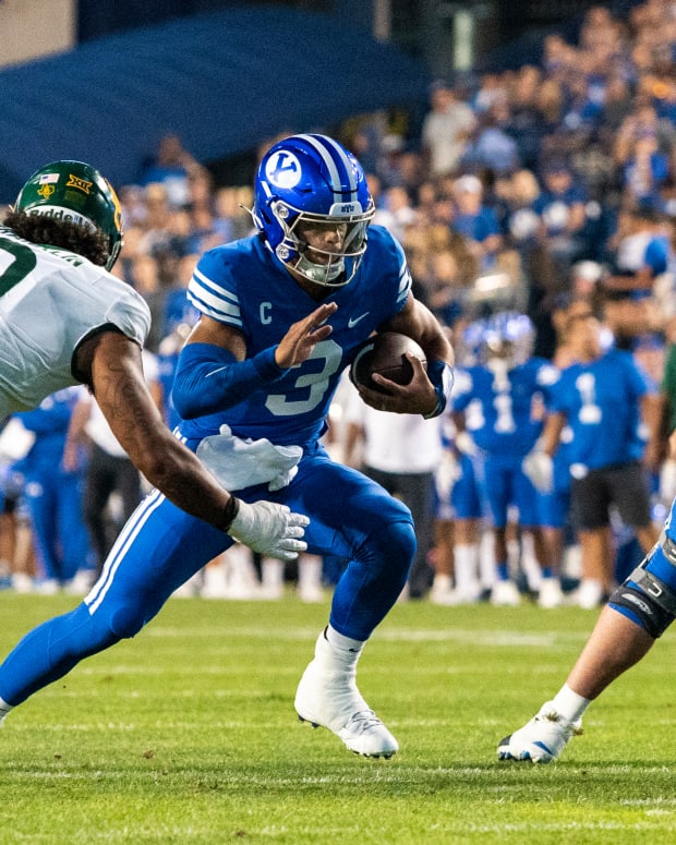 Sep 10, 2022; Provo, Utah, USA; Brigham Young Cougars quarterback Jaren Hall (3) runs the ball against Baylor Bears defensive lineman TJ Franklin (9) during the first half at LaVell Edwards Stadium.