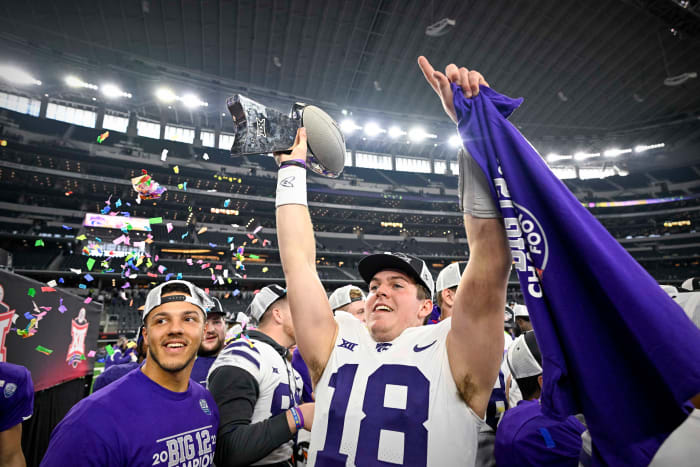 Dec 3, 2022; Arlington, TX, USA; Kansas State Wildcats quarterback Will Howard (18) holds up the championship trophy as the Wildcats celebrate winning the Big 12 championship after defeating the TCU Horned Frogs overtime at AT&T Stadium.