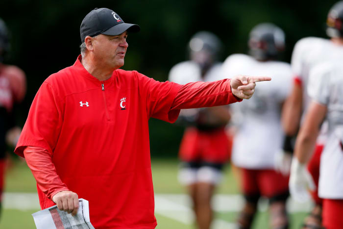 Cincinnati Bearcats offensive coordinator Mike Denbrock directs a drill during practice at the Higher Ground training facility in West Harrison, Ind., on Monday, Aug. 9, 2021. Cincinnati Bearcats Football Camp