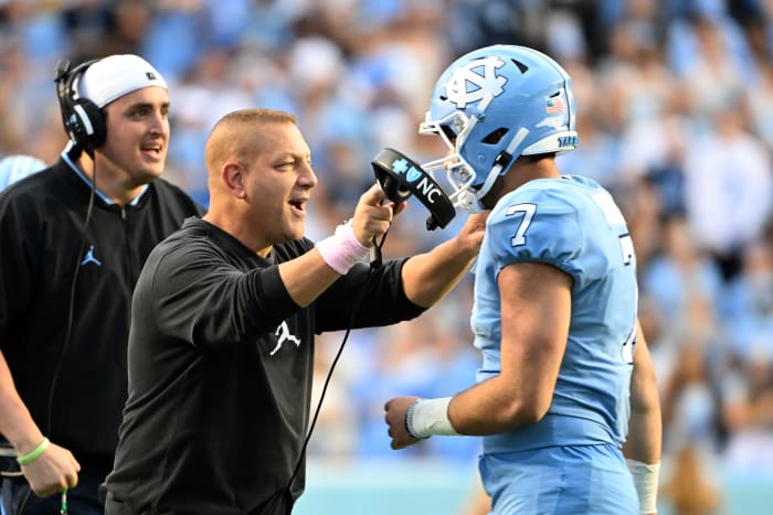 Oct 16, 2021; Chapel Hill, North Carolina, USA; North Carolina Tar Heels quarterback Sam Howell (7) with offensive coordinator Phil Longo after running for a touchdown in the third quarter at Kenan Memorial Stadium.