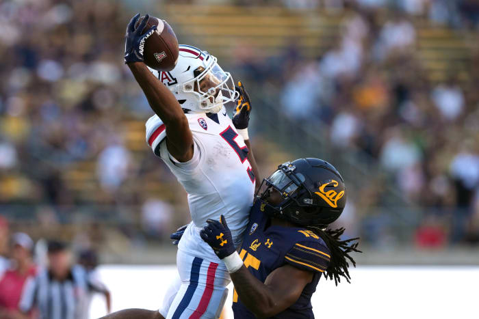 Sep 24, 2022; Berkeley, California, USA; Arizona Wildcats wide receiver Dorian Singer (5) catches a pass against California Golden Bears cornerback Lu-Magia Hearns III (15) during the fourth quarter at FTX Field at California Memorial Stadium.