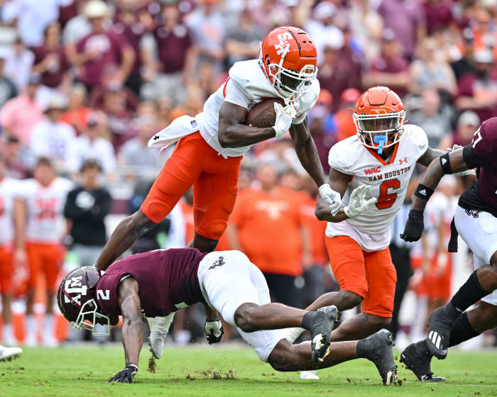 Sep 3, 2022; College Station, Texas, USA; Texas A&M Aggies defensive back Denver Harris (2) upends Sam Houston State Bearkats wide receiver Ife Adeyi (2) during the first quarter at Kyle Field.