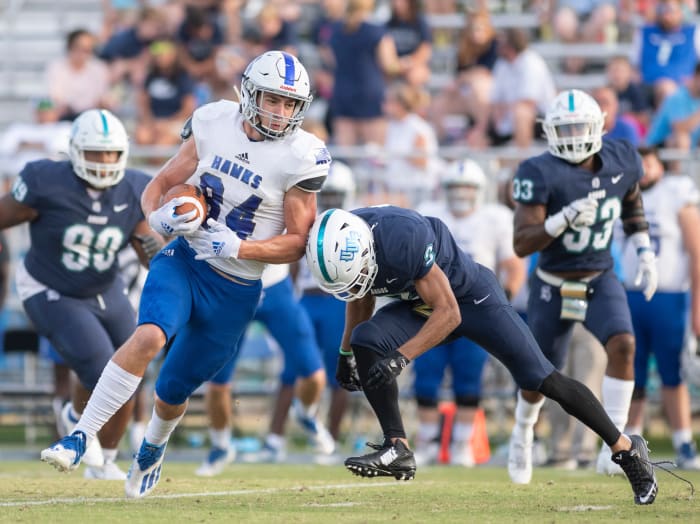 Marcus Clayton (3) moves in to stop Kyle Morlock (84) during the Shorter vs UWF football game at Blue Wahoos Stadium in Pensacola on Saturday, Oct. 23, 2021.