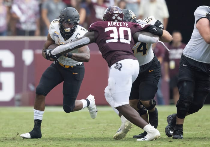 Sep 10, 2022; College Station, Texas, USA; Appalachian State Mountaineers running back Camerun Peoples (6) rushes against Texas A&M Aggies defensive lineman Tunmise Adeleye (30) in the second quarter at Kyle Field.