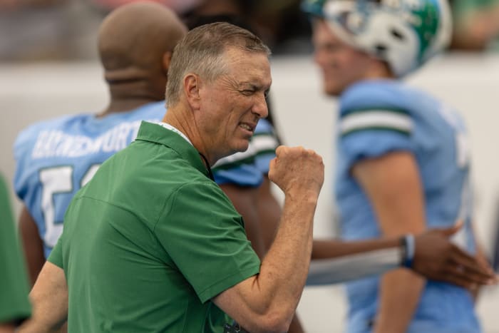 Dec 3, 2022; New Orleans, Louisiana, USA; Tulane Green Wave head coach Willy Fritz reacts to a fan with a fist bump against the UCF Knights during the first half at Yulman Stadium.