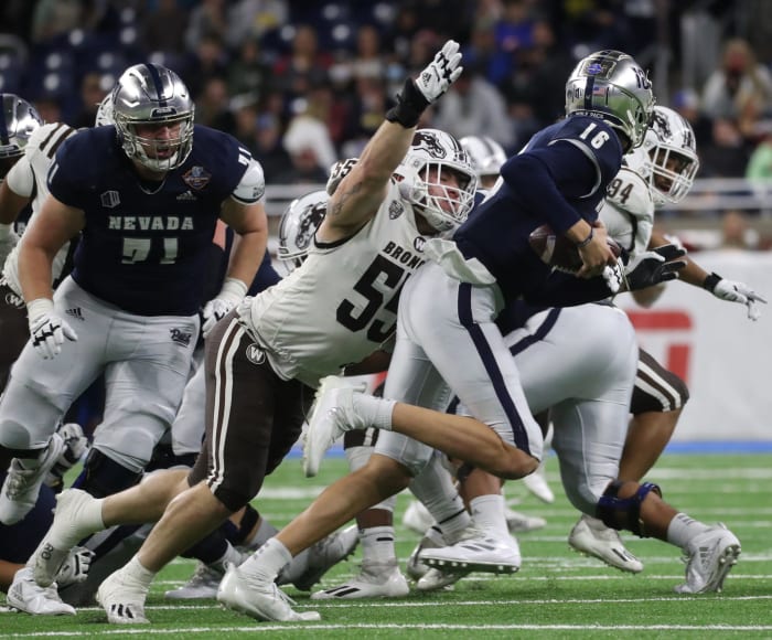 Western Michigan defensive lineman Braden Fiske sacks Nevada quarterback Nate Cox during the first half of the Quick Lane Bowl on Monday, Dec. 27, 2021, at Ford Field.