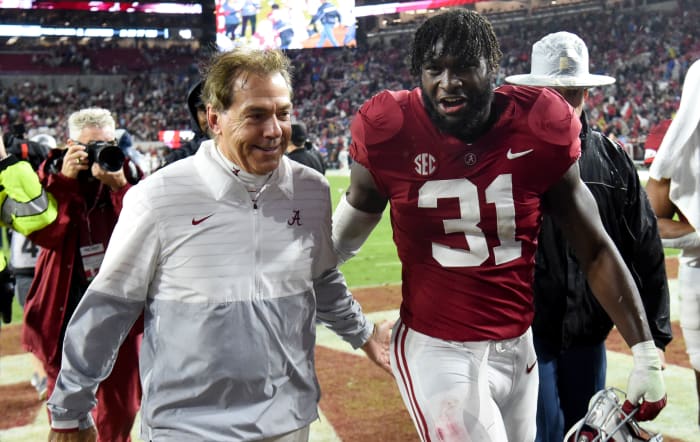 Nov 26, 2022; Tuscaloosa, Alabama, USA; Alabama Crimson Tide head coach Nick Saban and linebacker Will Anderson Jr. (31) share a smile as they leave the field after defeating the Auburn Tigers at Bryant-Denny Stadium. Alabama won 49-27.