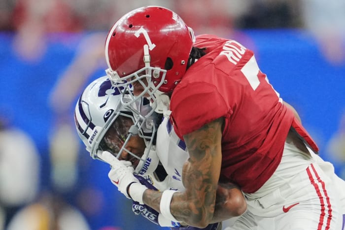 Dec 31, 2022; New Orleans, LA, USA; Alabama Crimson Tide defensive back Eli Ricks (7) tackles Kansas State Wildcats wide receiver Malik Knowles (4) during the first half in the 2022 Sugar Bowl at Caesars Superdome.