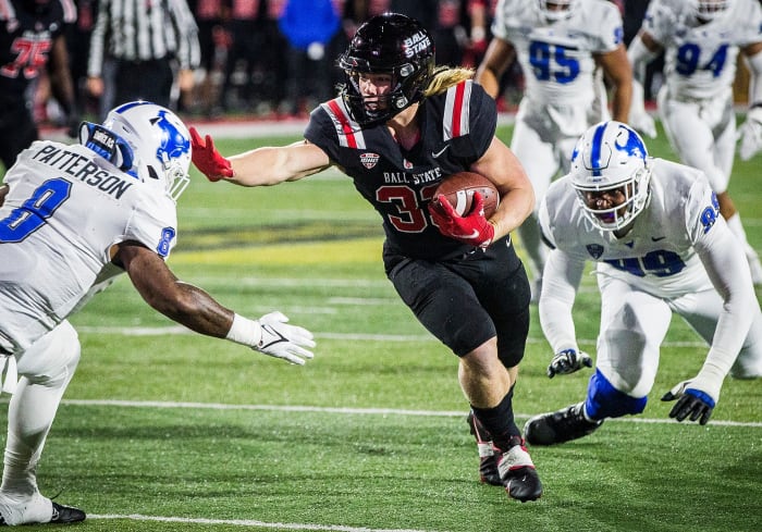 Ball State's Carson Steele slips past Buffalo's defense at Scheumann Stadium Tuesday, Nov. 23, 2021.