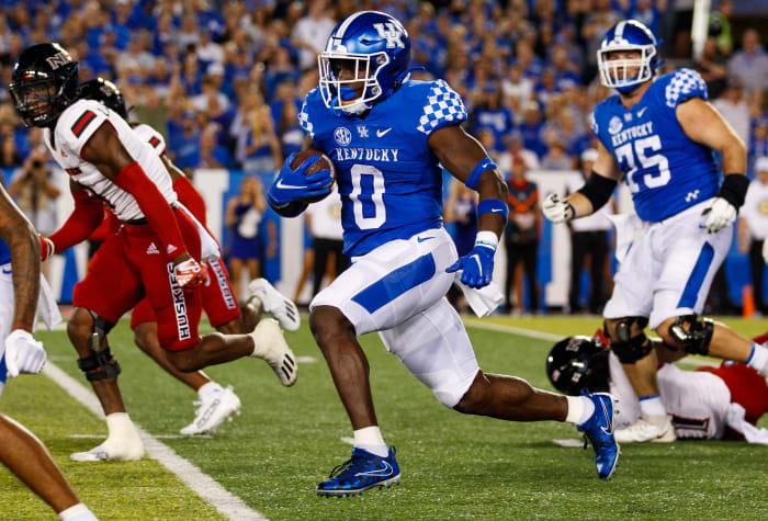 Sep 24, 2022; Lexington, Kentucky, USA; Kentucky Wildcats running back Kavosiey Smoke (0) runs the ball during the second quarter against the Northern Illinois Huskies at Kroger Field.