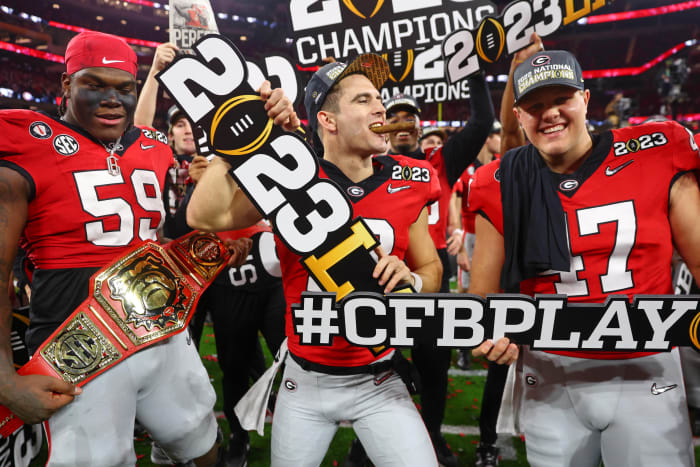 Jan 9, 2023; Inglewood, CA, USA; Georgia Bulldogs offensive lineman Broderick Jones (59) and quarterback Stetson Bennett (13) and long snapper Payne Walker (right) celebrate after winning the CFP national championship game against the TCU Horned Frogs at SoFi Stadium.