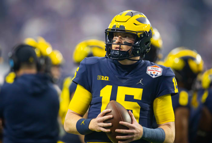 Dec 31, 2022; Glendale, Arizona, USA; Michigan Wolverines quarterback Alan Bowman (15) against the TCU Horned Frogs during the 2022 Fiesta Bowl at State Farm Stadium.