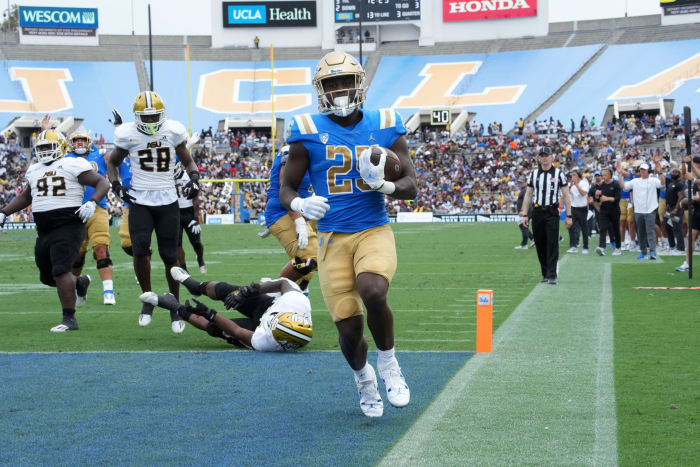 Sep 10, 2022; Pasadena, California, USA; UCLA Bruins running back TJ Harden (25) scores a 13-yard touchdown run in the second half against the Alabama State Hornets at Rose Bowl.