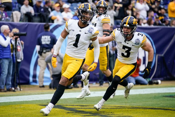 Iowa defensive back Xavier Nwankpa (1) celebrates his touchdown with Cooper DeJean (3) against Kentucky during the second quarter of the TransPerfect Music City Bowl, Saturday, Dec. 31, 2022, at Nissan Stadium in Nashville, Tenn.