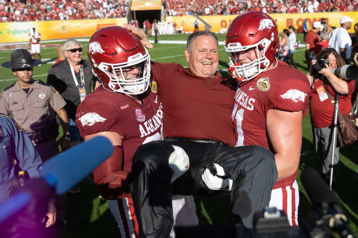 Jan 1, 2022; Tampa, FL, USA; Arkansas Razorbacks head coach Sam Pittman smiles with offensive lineman Ryan Winkel (71) after the game against the Penn State Nittany Lions during the 2022 Outback Bowl at Raymond James Stadium.