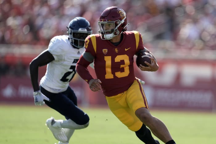 Sep 3, 2022; Los Angeles, California, USA; Southern California Trojans quarterback Caleb Williams (13) carries the ball in the first half against the Rice Owls at United Airlines Field at Los Angeles Memorial Coliseum. Mandatory Credit: Kirby Lee-USA TODAY Sports