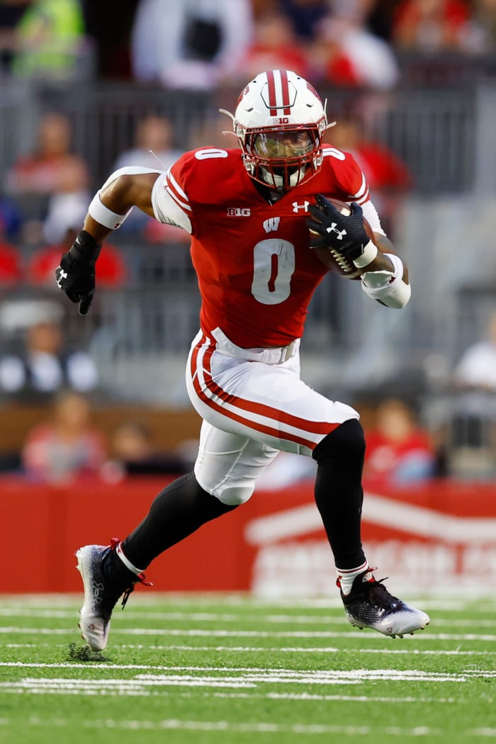 Sep 3, 2022; Madison, Wisconsin, USA; Wisconsin Badgers running back Braelon Allen (0) rushes with the football during the second quarter against the Illinois State Redbirds at Camp Randall Stadium. Mandatory Credit: Jeff Hanisch-USA TODAY Sports