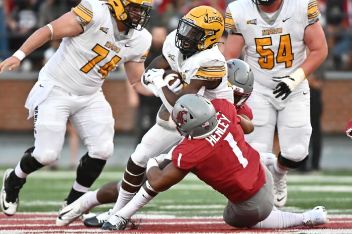 Sep 3, 2022; Pullman, Washington, USA;Idaho Vandals running back Anthony Woods (28) is stoped for a loss by Washington State Cougars linebacker Daiyan Henley (1) in the first half at Gesa Field at Martin Stadium. Mandatory Credit: James Snook-USA TODAY Sports
