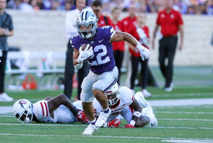 Sep 3, 2022; Manhattan, Kansas, USA; Kansas State Wildcats running back Deuce Vaughn (22) runs the ball for a touchdown against the South Dakota Coyotes in the first quarter at Bill Snyder Family Football Stadium.