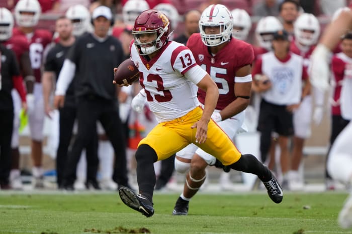 Sep 10, 2022; Stanford, California, USA; USC Trojans quarterback Caleb Williams (13) runs with the football against the Stanford Cardinal during the first quarter at Stanford Stadium.