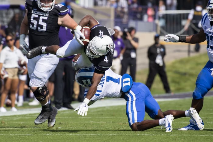 Sep 10, 2022; Evanston, Illinois, USA; Duke Blue Devils defensive back Darius Joiner (1) tackles Northwestern Wildcats running back Cam Porter (4) during the first quarter at Ryan Field.