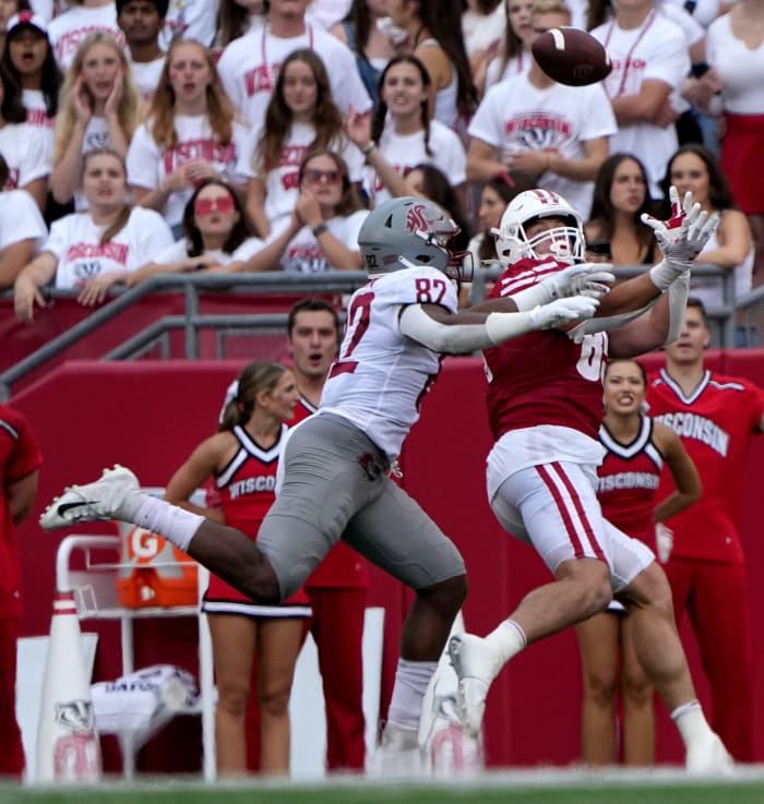 Wisconsin tight end Clay Cundiff (85) reels in a 17-yard touchdown pass while being covered by Washington State linebacker Travion Brown (82) during the second quarter of their game Saturday, September 10, 2022 at Camp Randall Stadium in Madison, Wis.